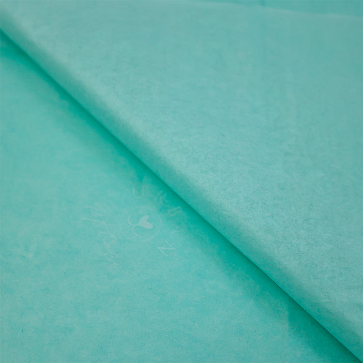 Turquoise wrapping paper pattern with white printing