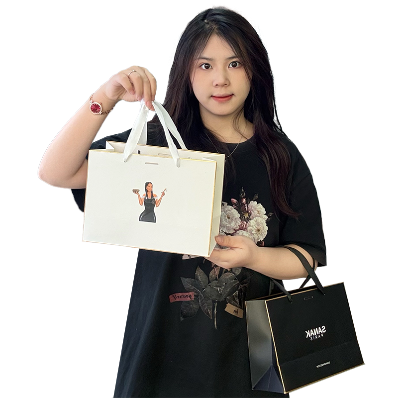 Black and white same style gold-painted paper bag