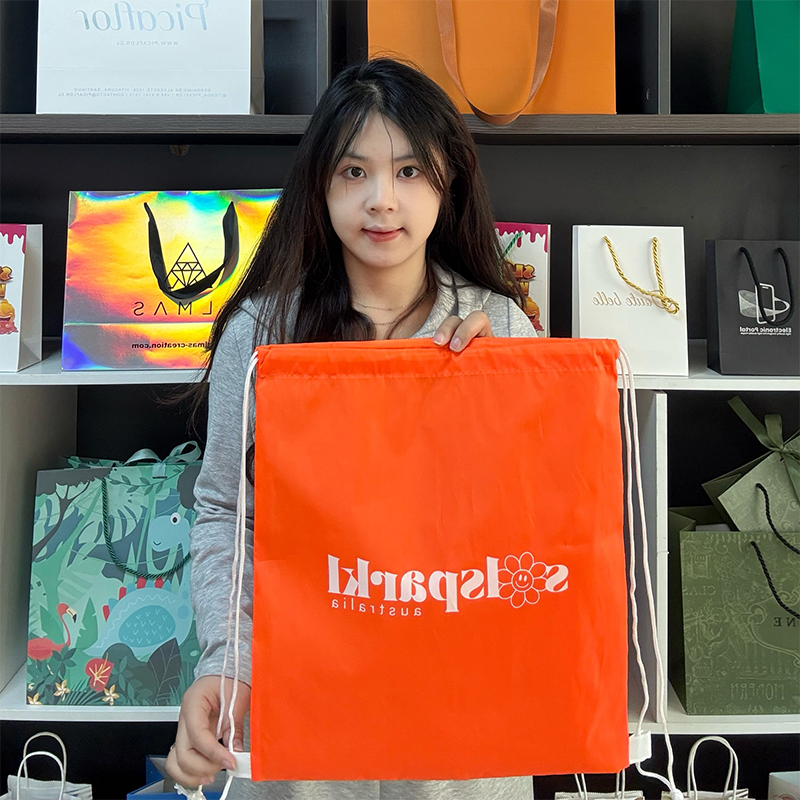 Orange drawstring backpack bag