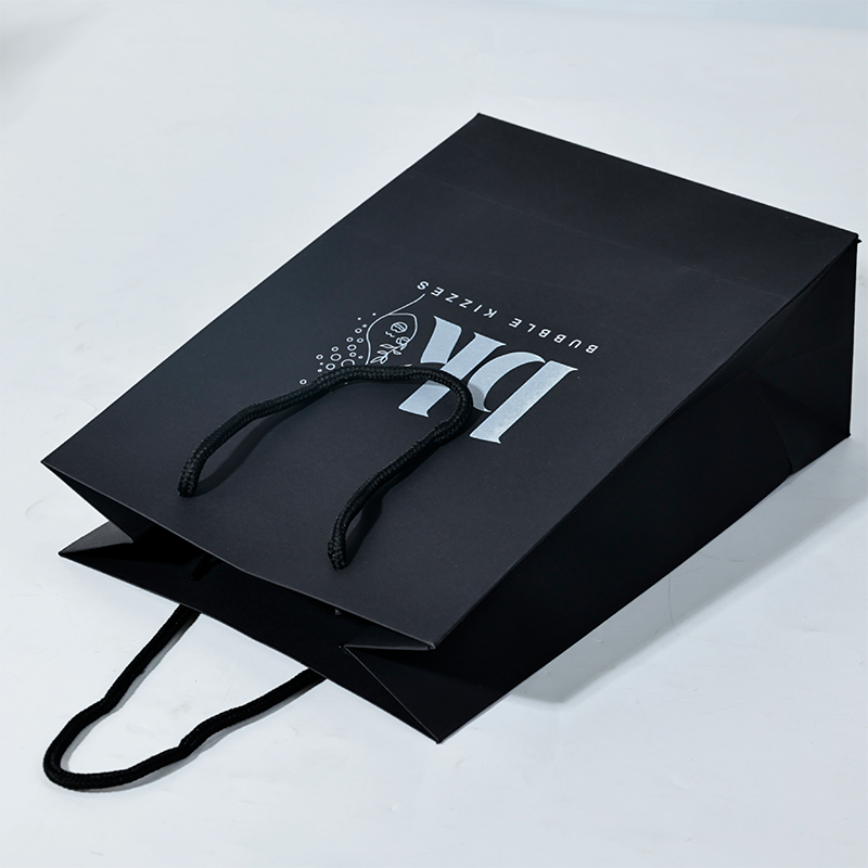 Black pattern printed white paper bag
