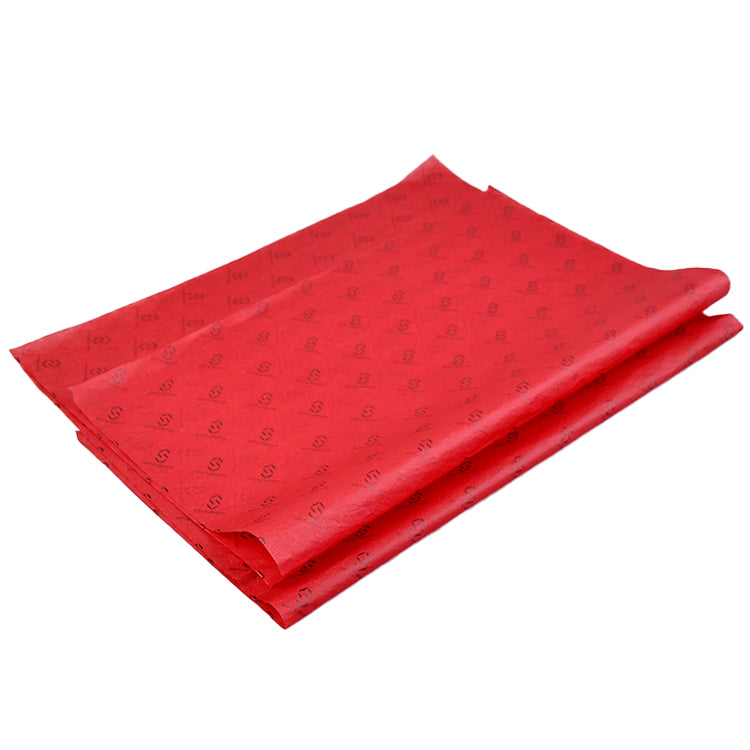 Red wrapping paper with black pattern printing