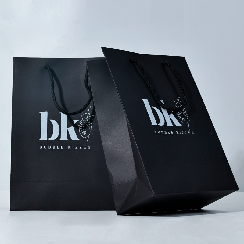 Black pattern printed white paper bag