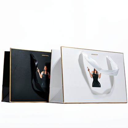 Black and white same style gold-painted paper bag