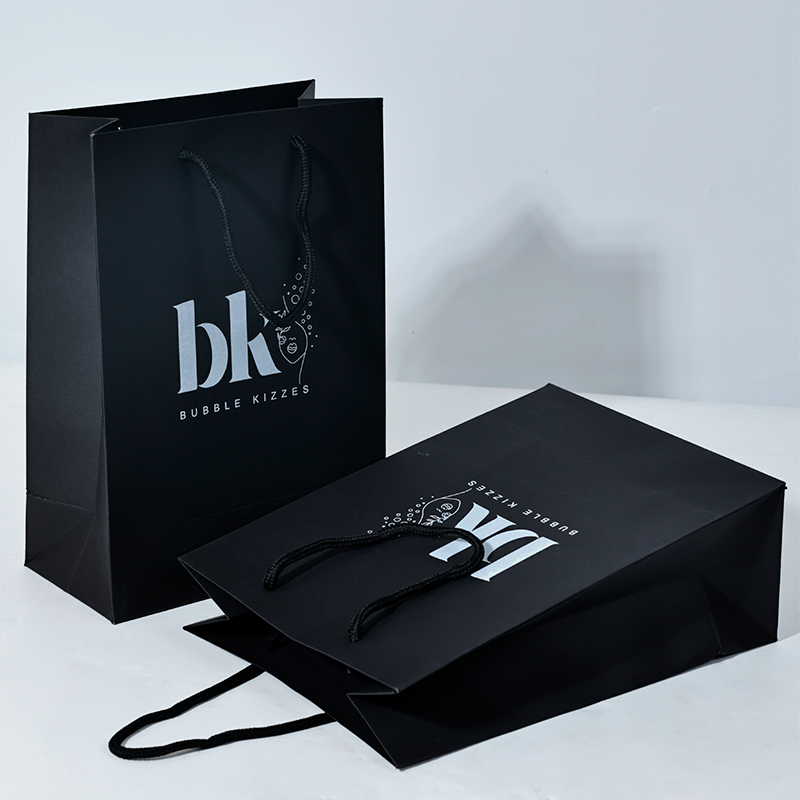 Black pattern printed white paper bag