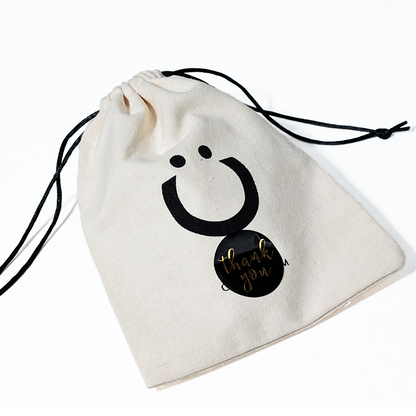 Off-white cotton drawstring bag