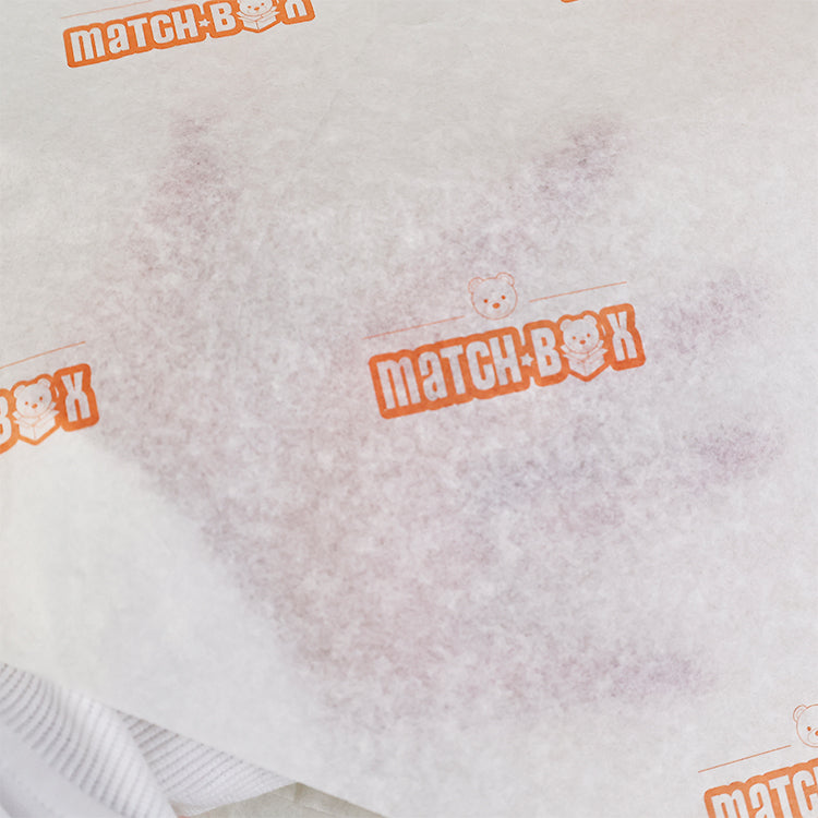 Light yellow wrapping paper with orange pattern printing
