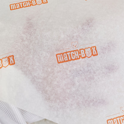 Light yellow wrapping paper with orange pattern printing
