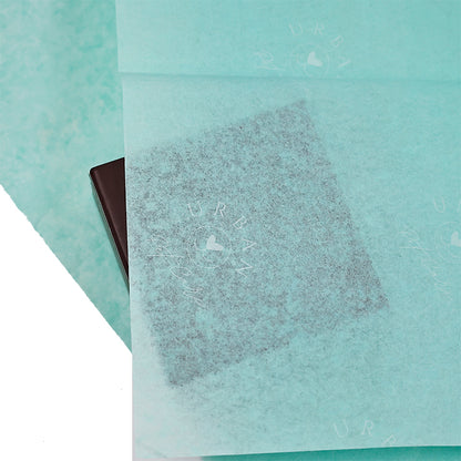 Turquoise wrapping paper pattern with white printing