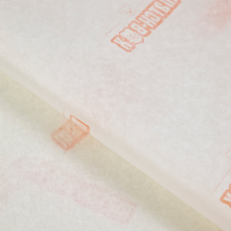 Light yellow wrapping paper with orange pattern printing