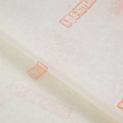 Light yellow wrapping paper with orange pattern printing