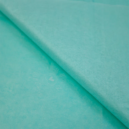 Turquoise wrapping paper pattern with white printing