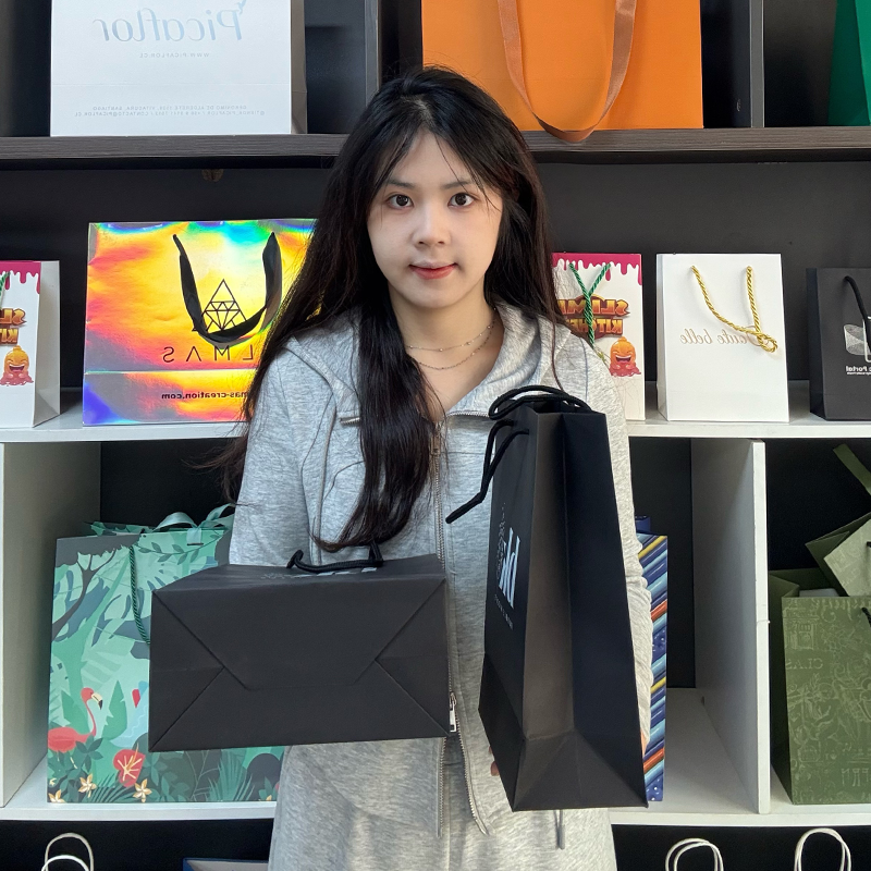 Black pattern printed white paper bag