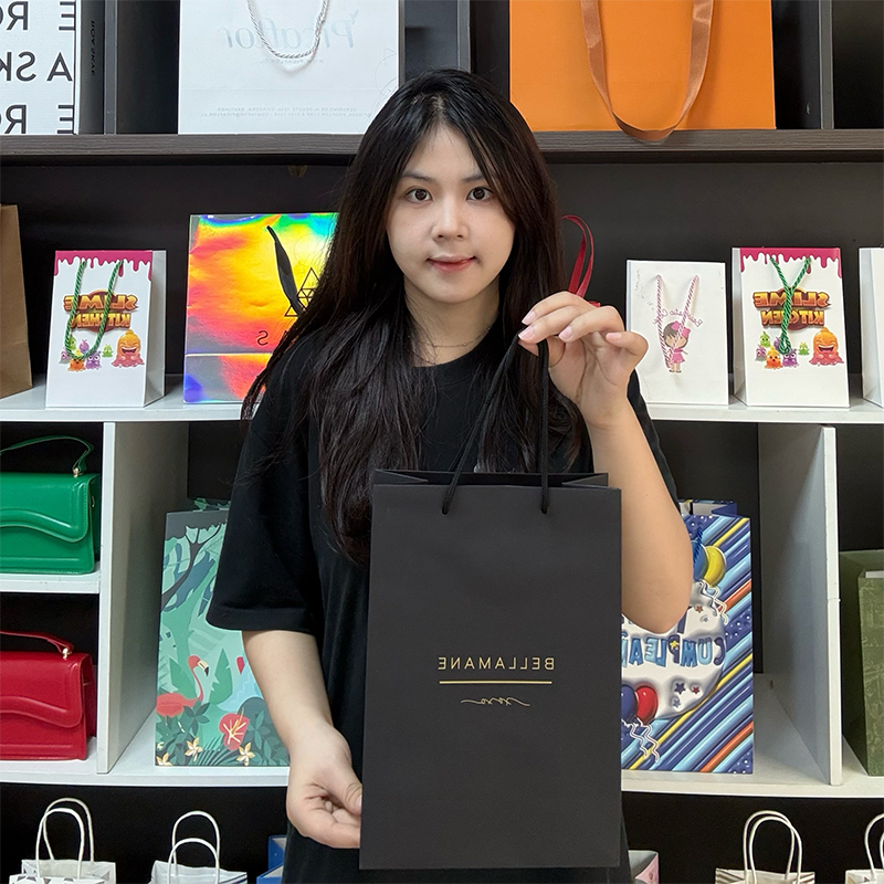 Black card tote bag with gold pattern