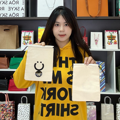 Off-white cotton drawstring bag