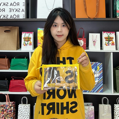 Transparent PVC yellow edging bottom zipper bag